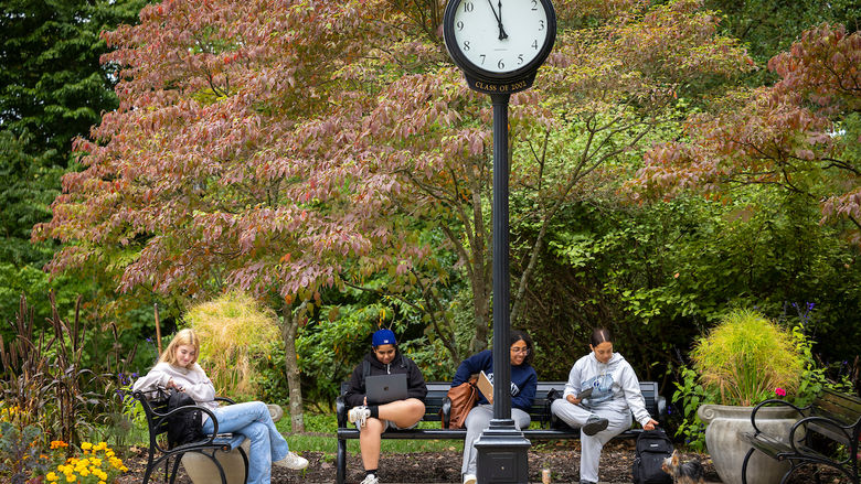 Students sitting on sutherland plaza benches