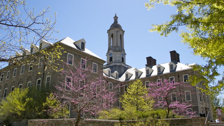 Old Main with foliage