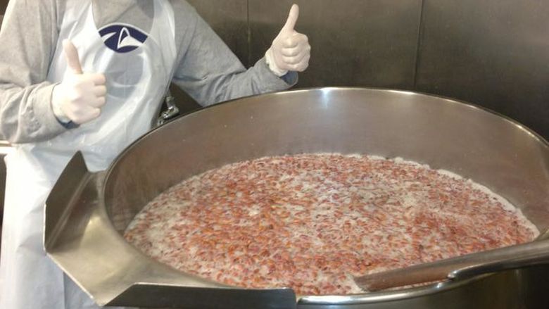Abington student with a pot of beans