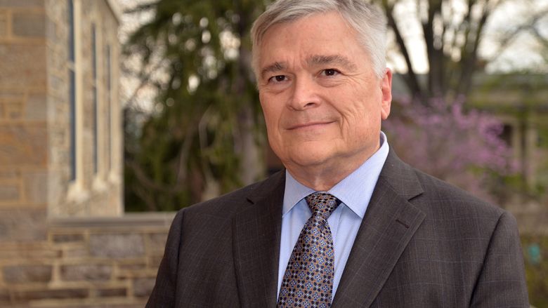 Portrait of Penn State President Eric Barron in front of Old Main on April 22, 2016.