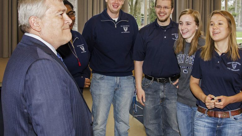 Penn State President Eric Barron talks to a group of students
