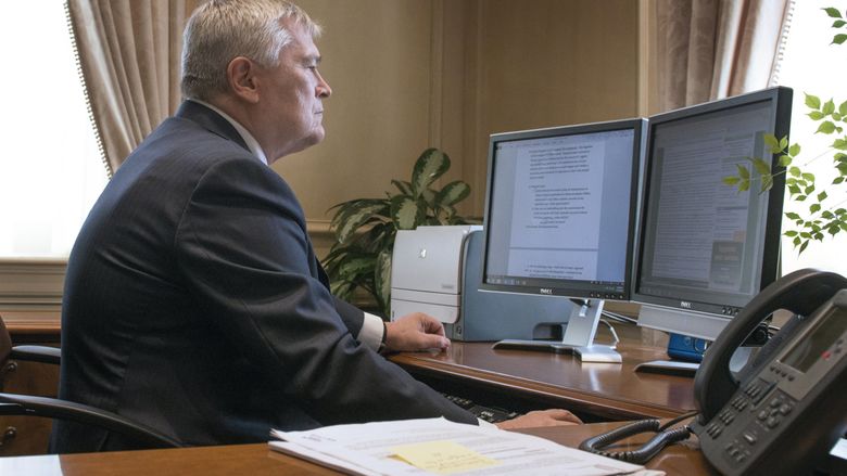 Eric Barron at his desk during his first morning as Penn State president