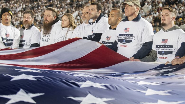 Veterans hold flag