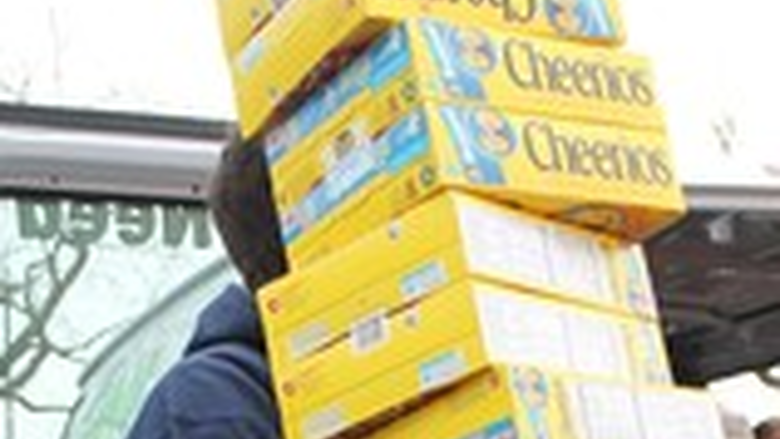 An Abington student carries boxes of Cheerios 