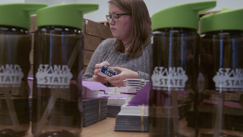 A student organizes stickers 