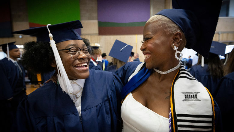 Two women in caps and gowns