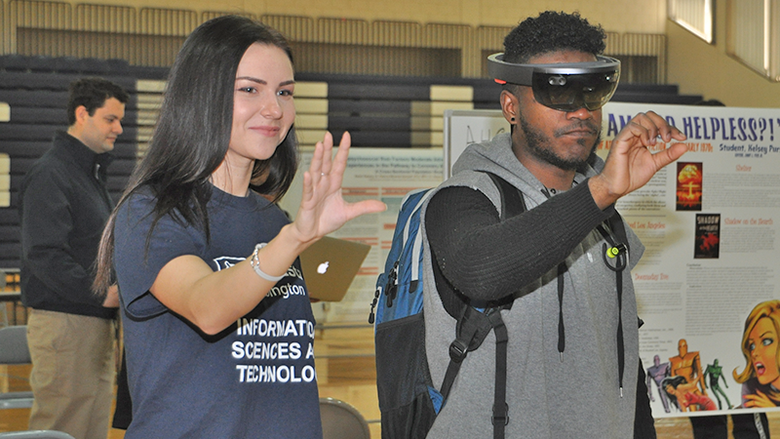 two students at the ACURA Fair