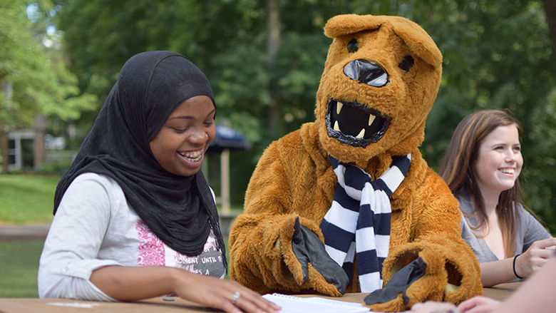 student with the Lion