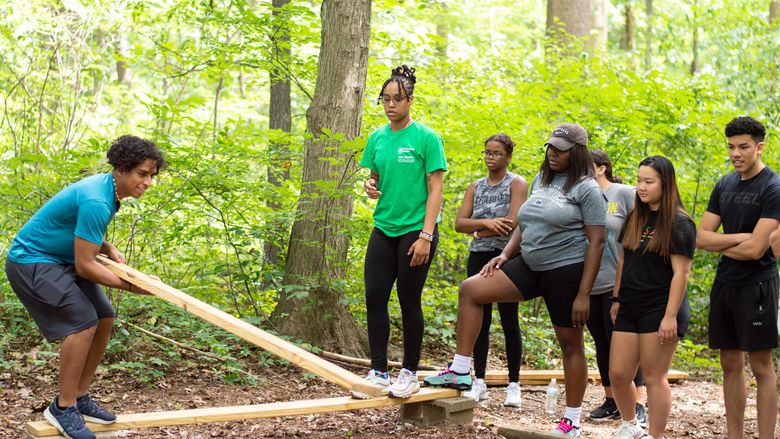 students working on team building exercise 
