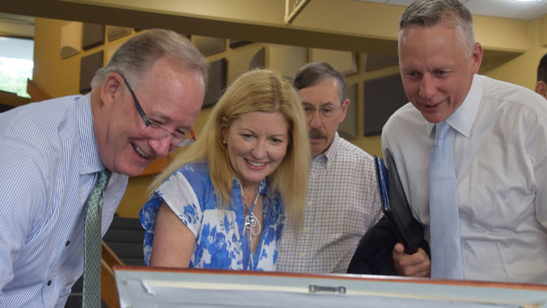 People looking at documents