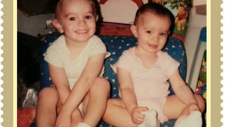 Two babies sitting together