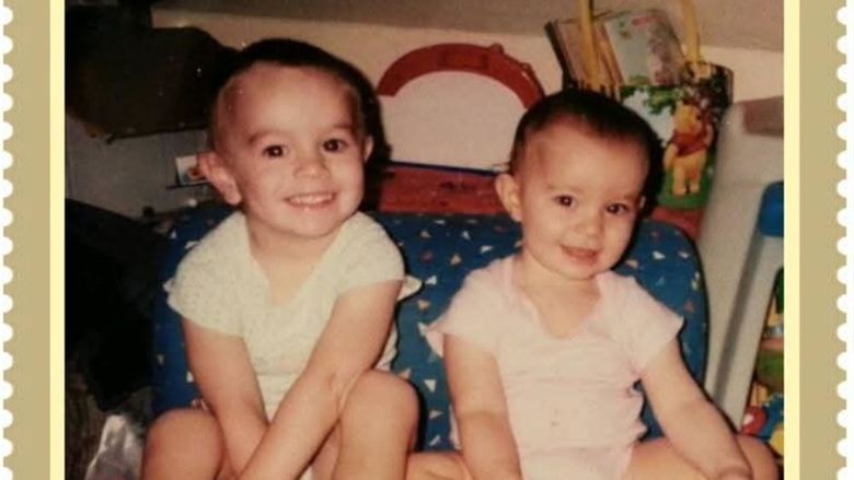 Two babies sitting together