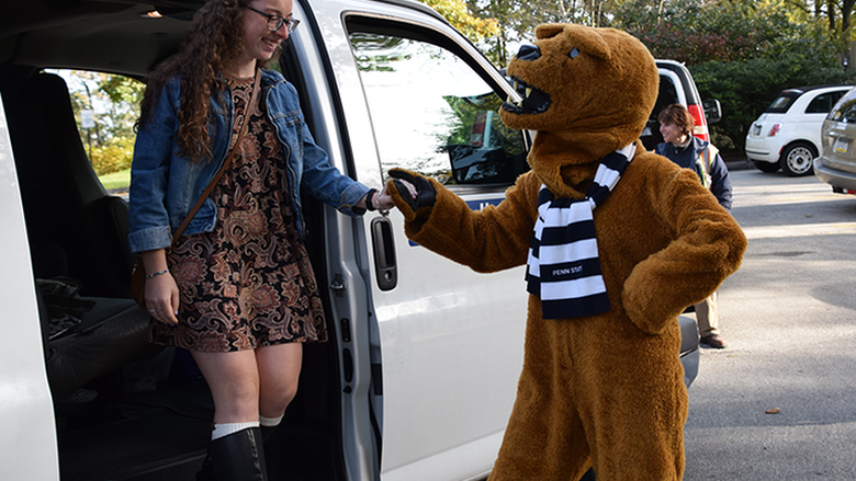 Student getting off shuttle 