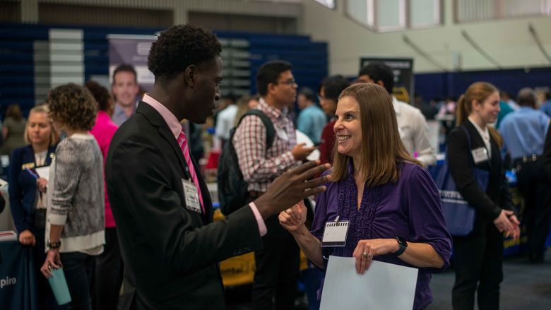 Student talking to employer at the Career Fair