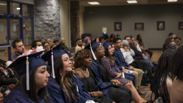 students sitting at ceremony