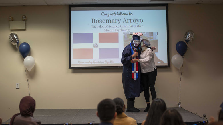 two people hugging at cultural graduation