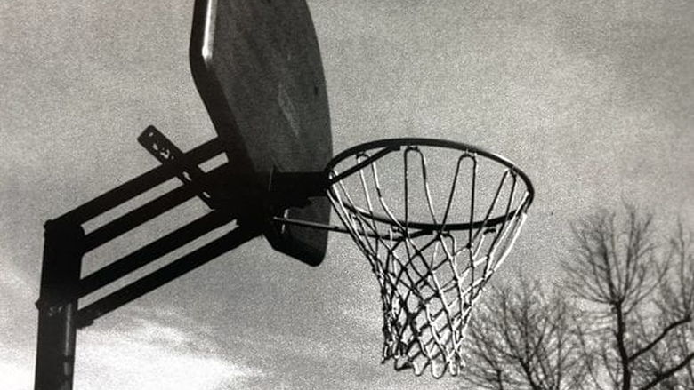 black and white photograph basketball net