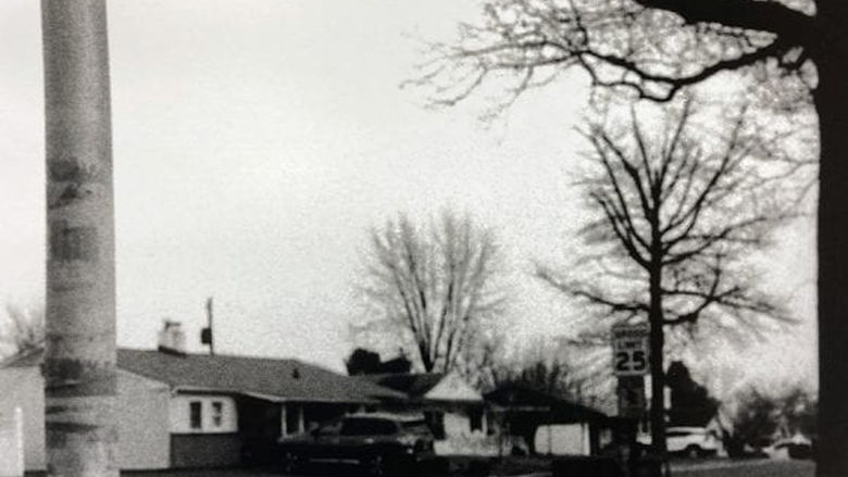 black and white photograph of a neighborhood