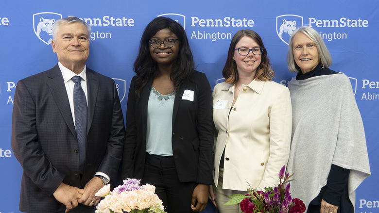 Dr. Eric Barron and his wife Molly with two Abington students