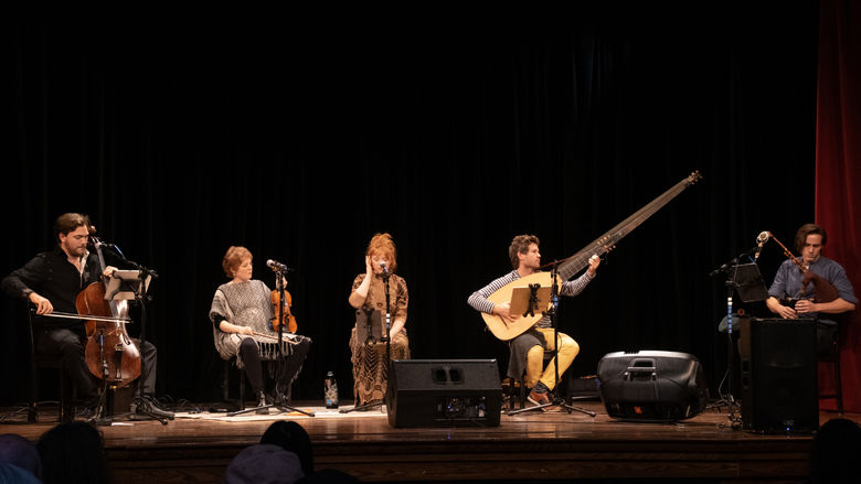 Chivalrous Crickets concert with members on stage