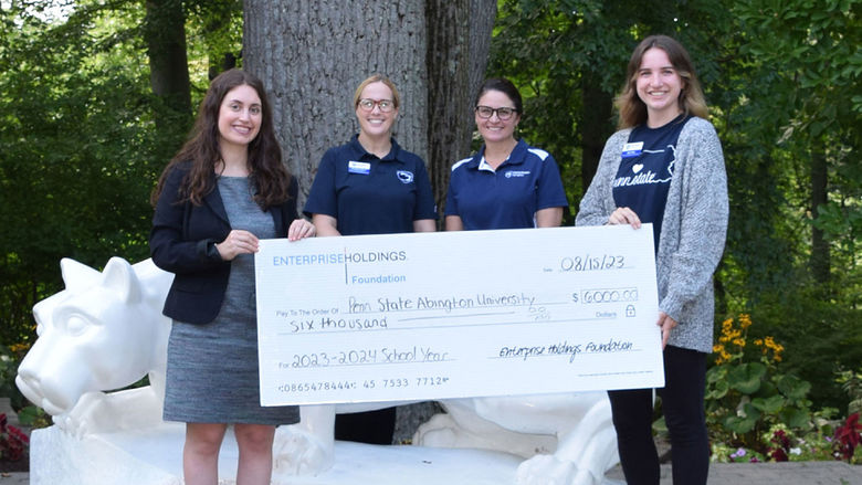 Enterprise Holdings staff present $6,000 check for career development at Penn State Abington