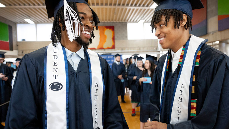 Two Penn State Abington student athletes celebrate their graduation