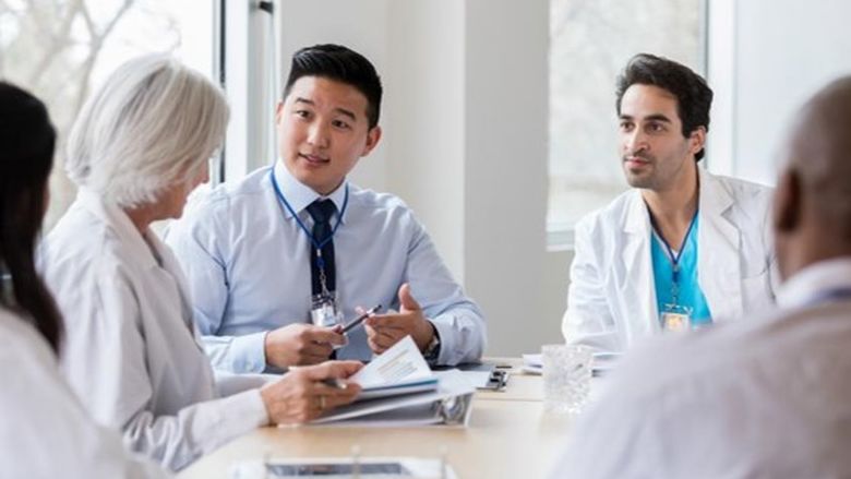 doctors talking at a table