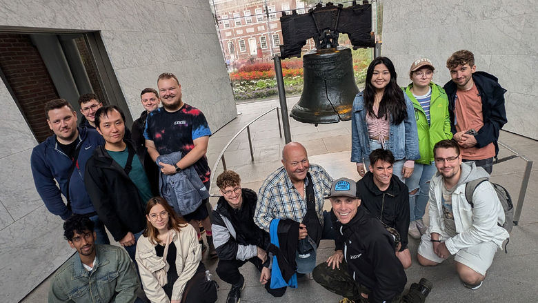 People stand around the Liberty Bell in Philadelphia