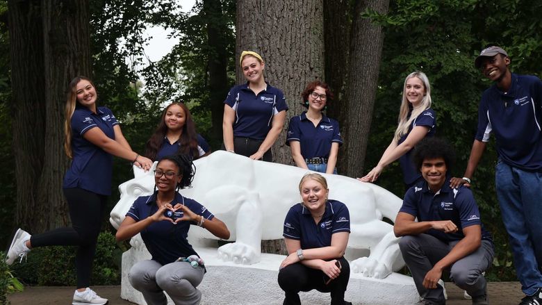 students standing around Nittany Lion Shrine