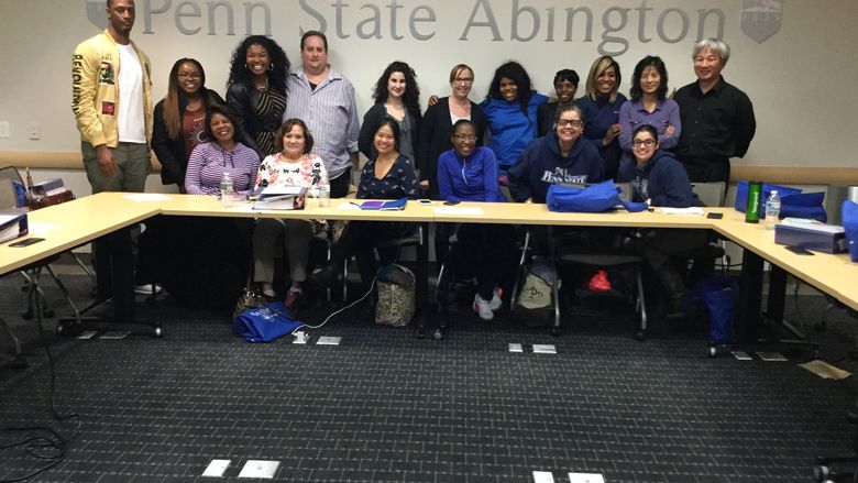 Group of students posing for picture in front of Penn State Abington sign