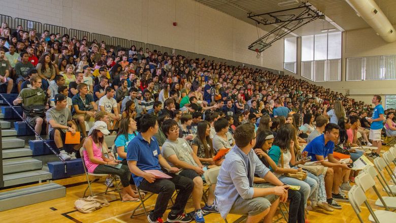 gymnasium full with students for opening convocation ceremonies