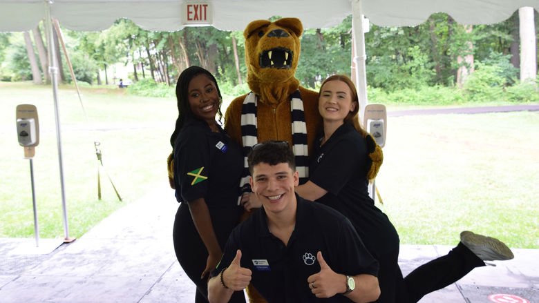 three students posing with Nittany Lion at Penn State Abington (near Philadelphia)