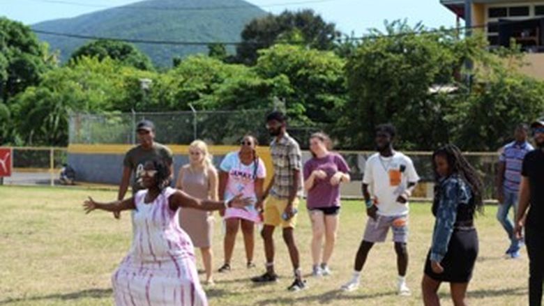 A group of students playing a game outside