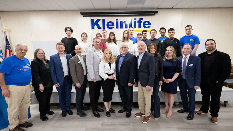 Group of people standing on a stage