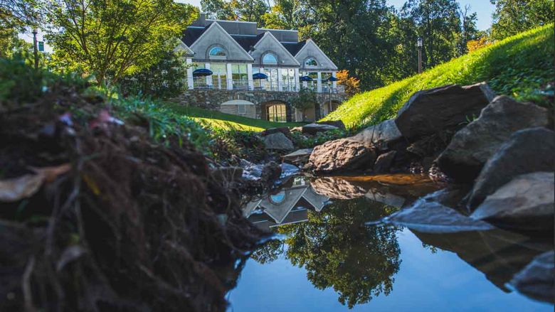 Lares building and pond reflection