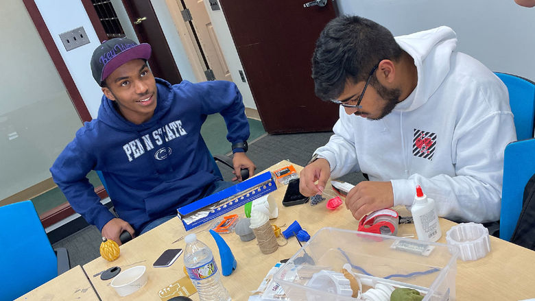 Two Penn State Abington students build a television antenna with less than $10 of materials