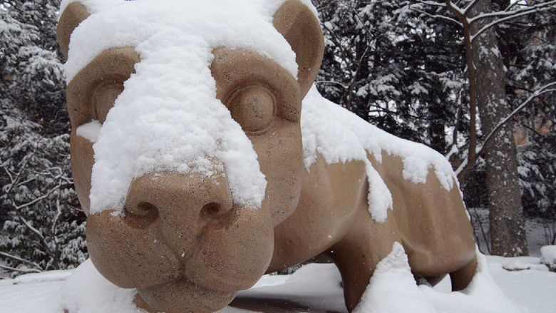 The Nittany Lion shrine covered in snow.