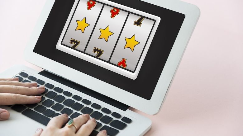 Slot machine style game on laptop computer screen