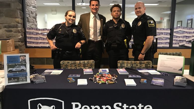 Officers at Coffee with a Cop event for employees.