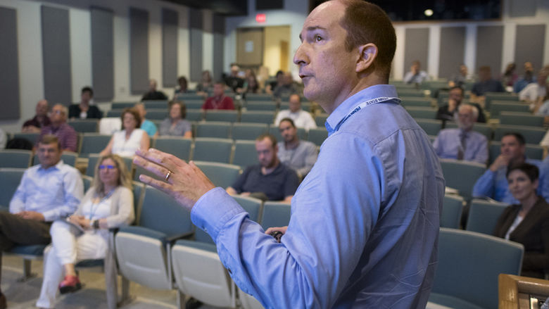 Andrew Muirhead presents his talk to faculty and staff