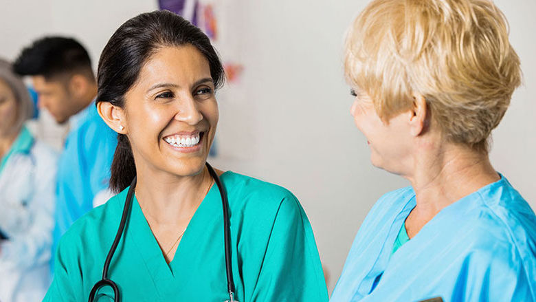 Nurses smiling at each other