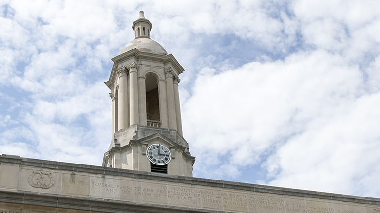 Old Main Bell Tower against Blue and White Sky