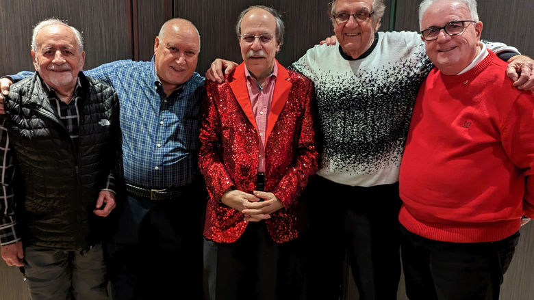 Five Penn State alumni dressed for a holiday party