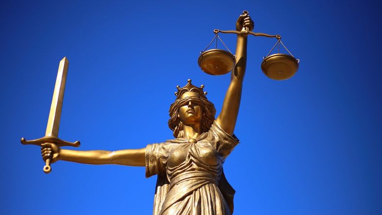 Statue holding sword and balance