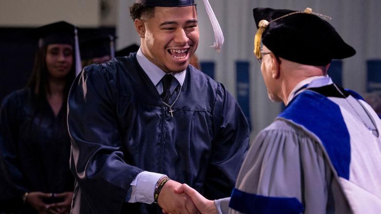 Student receives his college degree