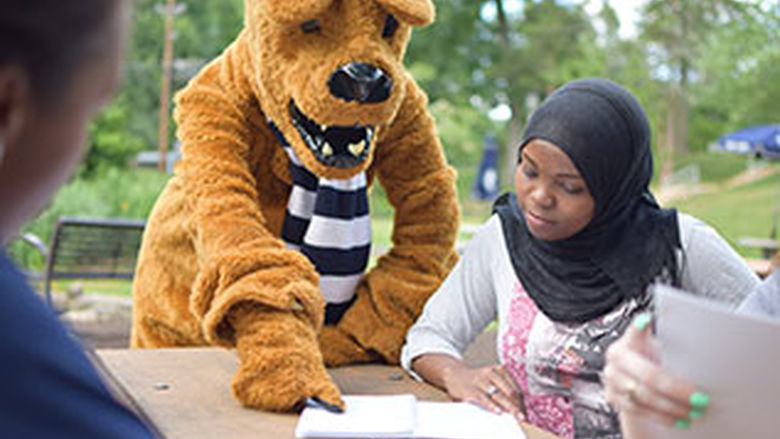 Penn State Abington student and the nittany lion