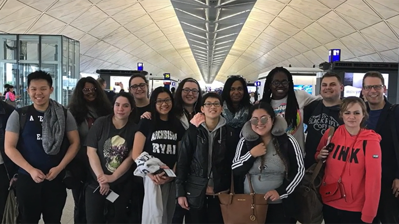 Students smiling in airport