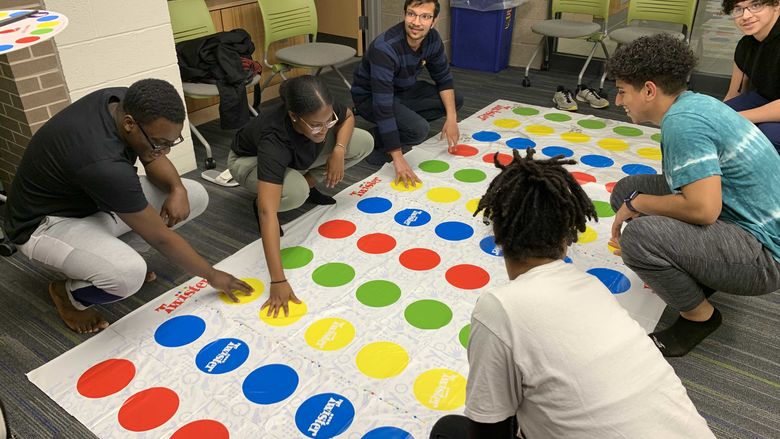 students playing twister in Lions Gate lounge
