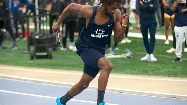 Student running in a track meet