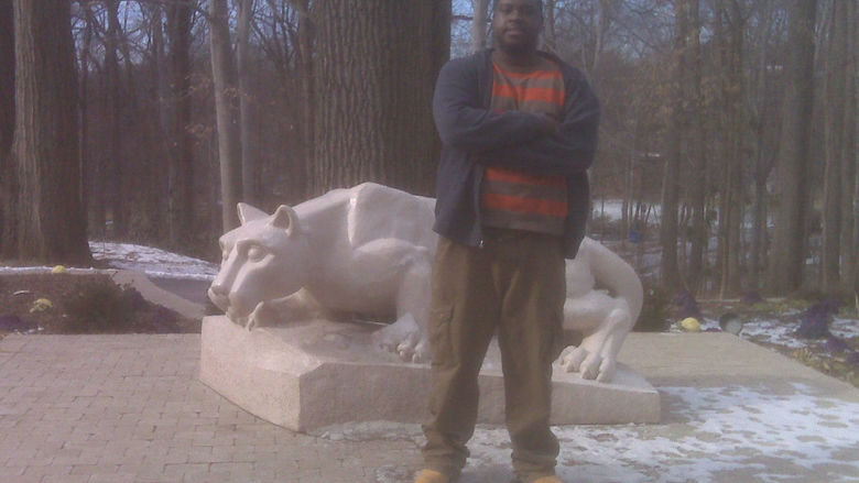 Vernon Walker in front of the Lion Shrine at Penn State Abington